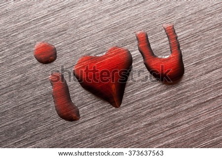The inscription I love you with a heart instead of the word love on a metal surface

