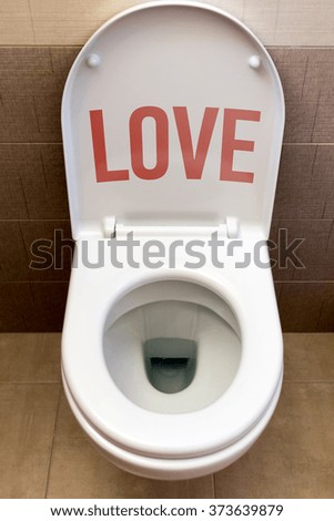 Toilet with inscription "Love"