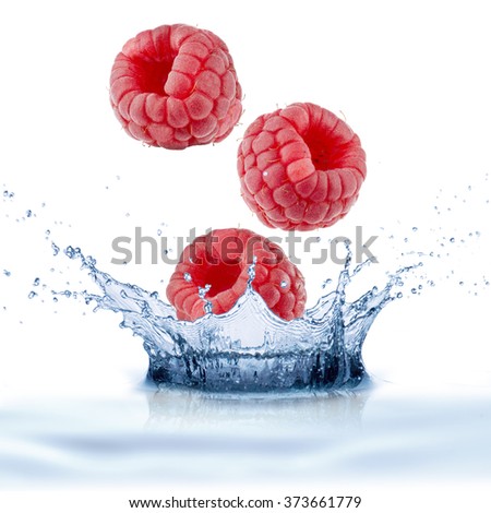 Raspberries Falling Into Water Splash