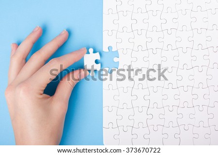Missing jigsaw puzzle pieces. Business concept. Compliting final task Royalty-Free Stock Photo #373670722