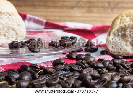 Coffee and bread wooden background