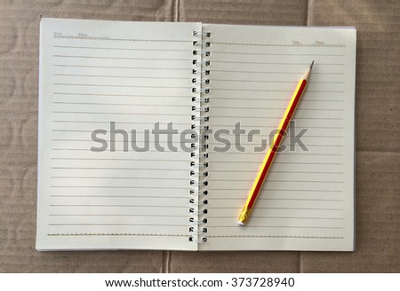 pencil on a notebook