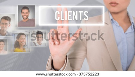 Businesswoman touching against skyscraper