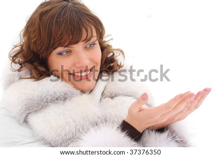 Picture of a young woman in fur coat with copy-space