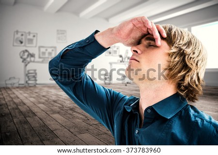 Troubled hipster businessman holding his head against doodle office in hallway