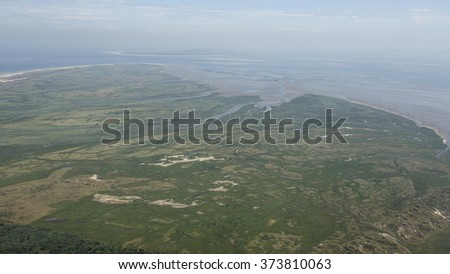 Aerial view of the Boschplaat at Terschelling, an island in the Waddenzee, Holland. The Waddenzee is on the UNESCO world heritage list. On the horizon the island Ameland.
