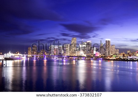View of Miami Downtown at night time with a view on a bay, USA
