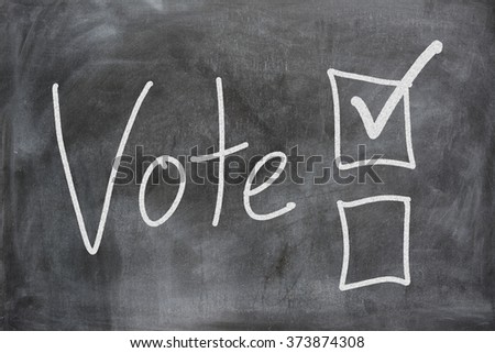 Voting boxes displayed on a chalk board Royalty-Free Stock Photo #373874308