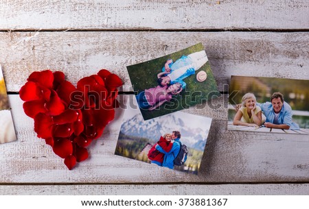 Photos of a couple in love. Red rose petal heart.
