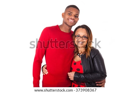 Happy mixed race couple hugging over a white background