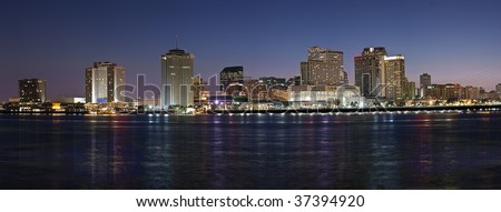 Panorama of downtown New Orleans after sunset from across Mississippi River