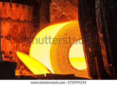 Roll of hot metal on the conveyor belt Royalty-Free Stock Photo #373999234