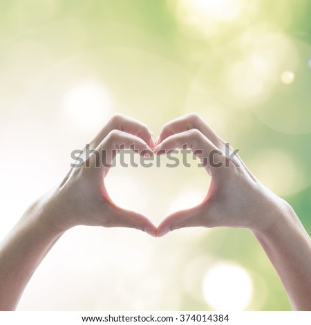 Hand in heart shape for eco friendly environment CSR in natural resource awareness concept Royalty-Free Stock Photo #374014384