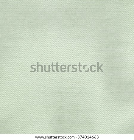 Woven cotton linen fabric textile textured backdrop in pastel light yellow spring green color