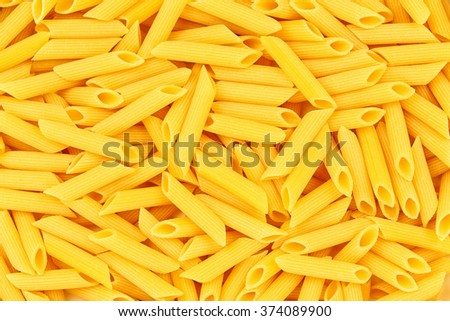 Italian Penne Rigate Macaroni Pasta raw food background or texture close up