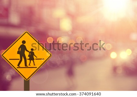 School sign on blur traffic road abstract background.Retro color style.
