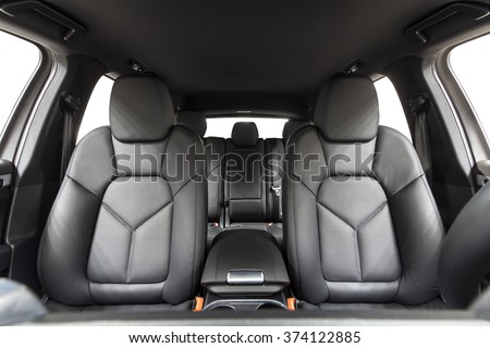 Car inside. Interior of prestige modern car. Comfortable leather seats. Black cockpit with on isolated white background. Royalty-Free Stock Photo #374122885