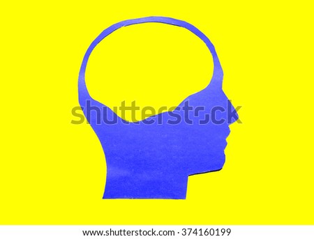 Blue paper human head with hollow space on yellow background