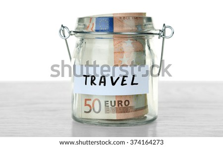 Jar for savings full of coins
