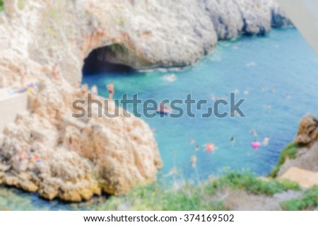 Defocused background of scenic seascape at Ciolo Bridge, Apulia, Italy. Intentionally blurred post production for bokeh effect