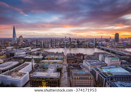Panoramic skyline shot of south London at dusk with beautiful sunset and clouds and famous skyscrapers and landmarks - London, UK