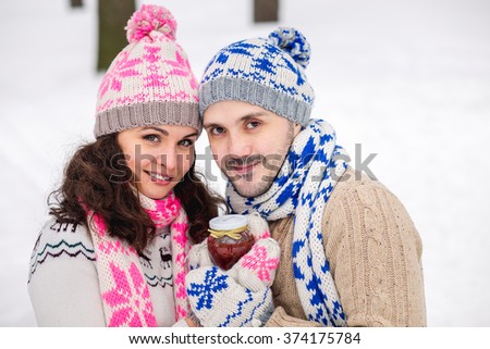 bright picture of family winter love story couple in a wool winter clothing.