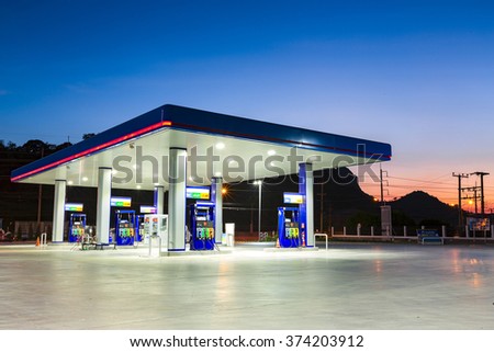 Gas station at sunset. Royalty-Free Stock Photo #374203912