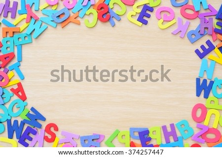 letters of the English alphabet on wooden floor with copy space.
