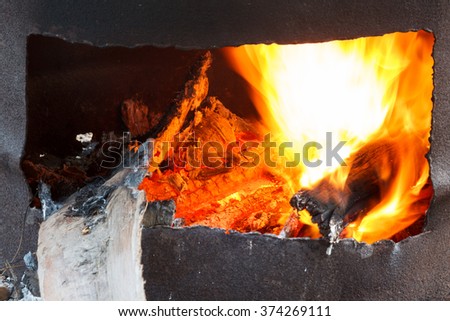 burning of coal or wood in stove
