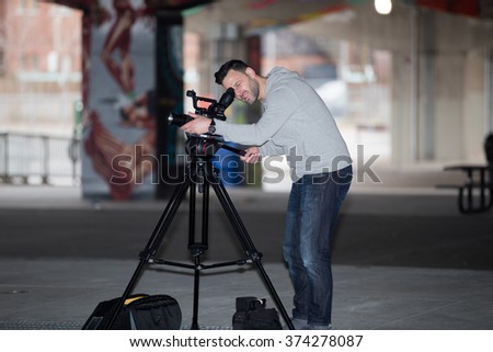 Videographer shoots the city. 