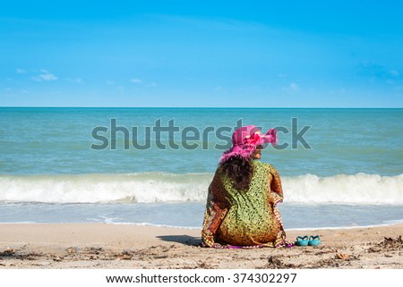 beauty women sitting at the beach