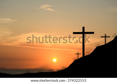 Cross silhouette. Sunset background.