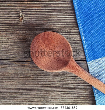 wooden kitchen spoon and towel