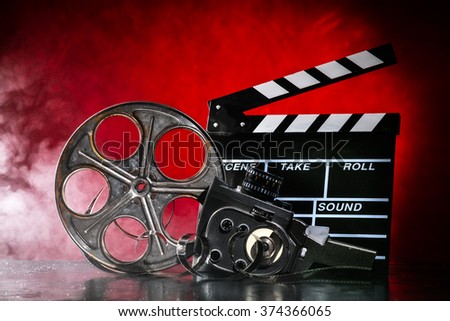Retro film production accessories still life. Concept of film-making. Smoke effect on background