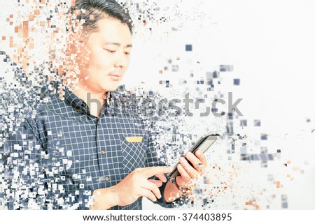 asian businessman using mobile phone or tablet pc at white background for any text. Art effect of pixelated decomposition. Business, wireless technology, internet, payments, mobile banking