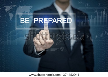 Businessman hand touching BE PREPARED button on virtual screen