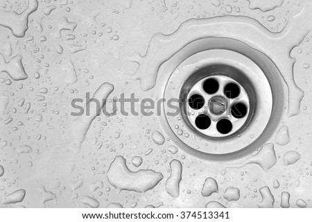 View of the sink, drain and flowing water for background Royalty-Free Stock Photo #374513341
