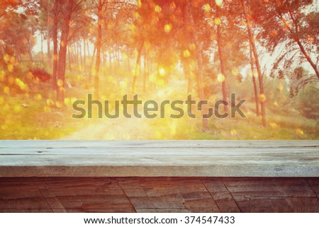 background of front rustic wood boards and abstract forest background.