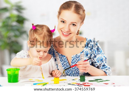 mother and child baby daughter draw paints