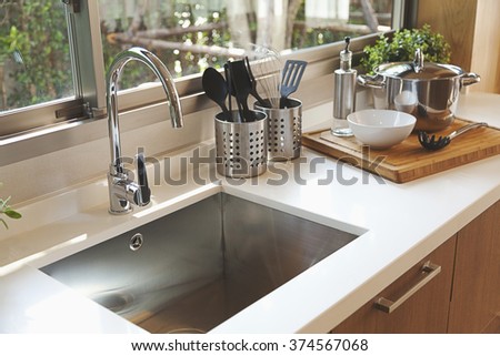 Kitchen sink and faucet Royalty-Free Stock Photo #374567068