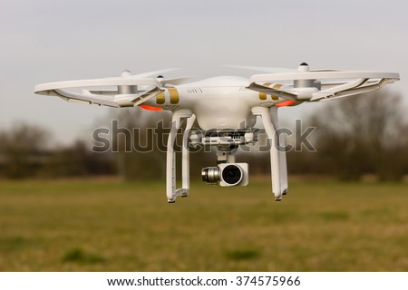 A drone flying over a meadow Royalty-Free Stock Photo #374575966