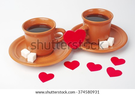 Two cups of coffee with heart shape padlock.
