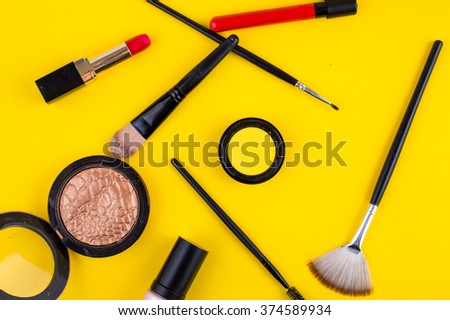cosmetics lipstick shade brush on a yellow background