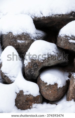 The stones under the snow in winter