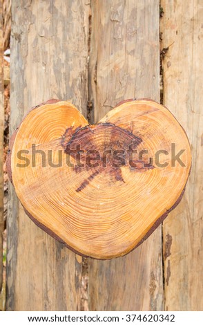 a heart shape wooden sit