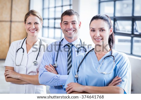 Medical team smiling at camera together at the hospital