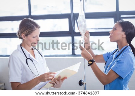 Medical team preparing an IV drip at the hospital