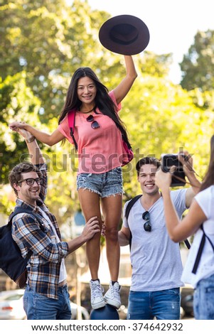 Hip friends posing for a picture on the street