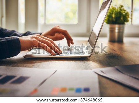businessman using laptop computer sitting working office. Royalty-Free Stock Photo #374648065