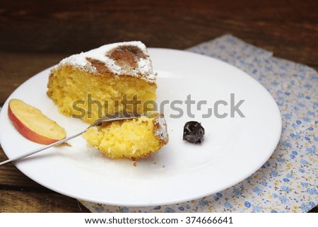 Piece of pumpkin pie on a white plate